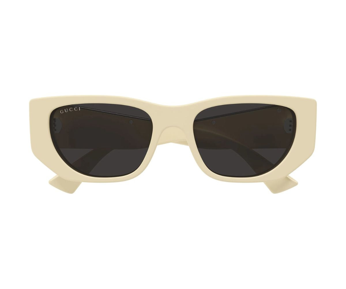 Cream Gucci sunglasses with dark lenses, stylish designer frames for women and men