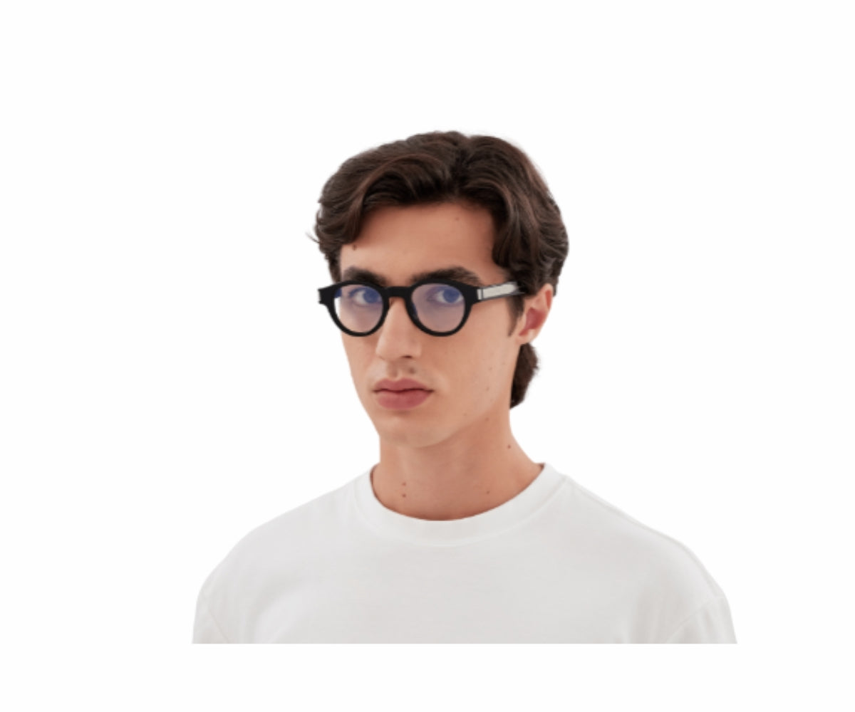 Man wearing stylish black round eyeglasses with silver temples, modern designer frames for everyday wear