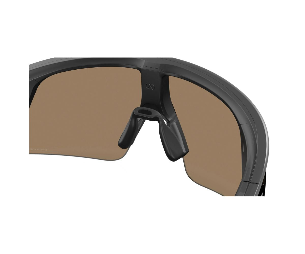 Black Oakley sunglasses with brown lenses, sleek sporty design for outdoor activities