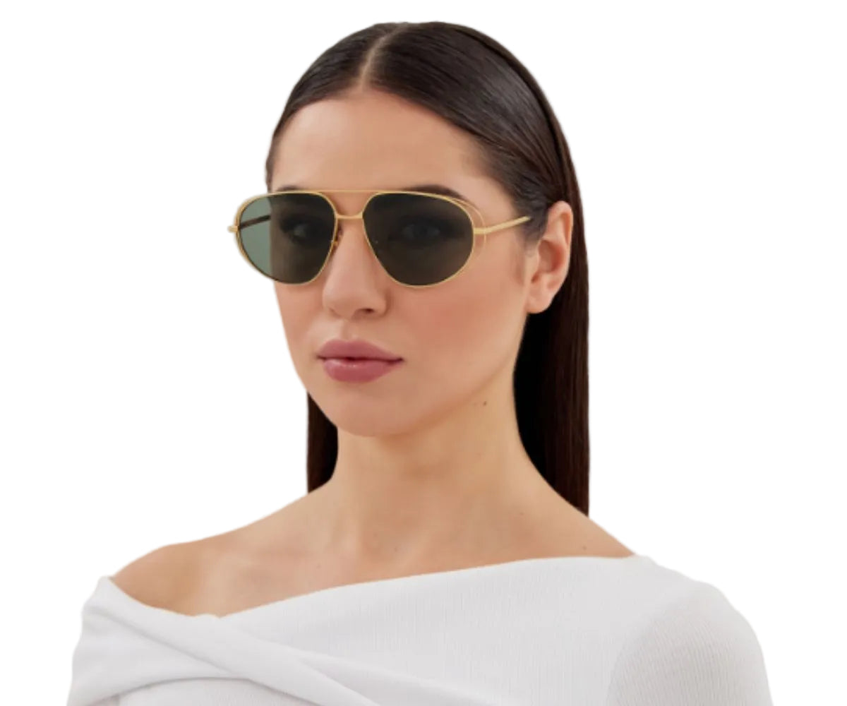 Gold aviator sunglasses with dark lenses, stylish women's fashion accessory