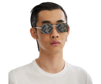 Men's designer sunglasses with FF logo pattern, silver frame, and matching earrings view 4