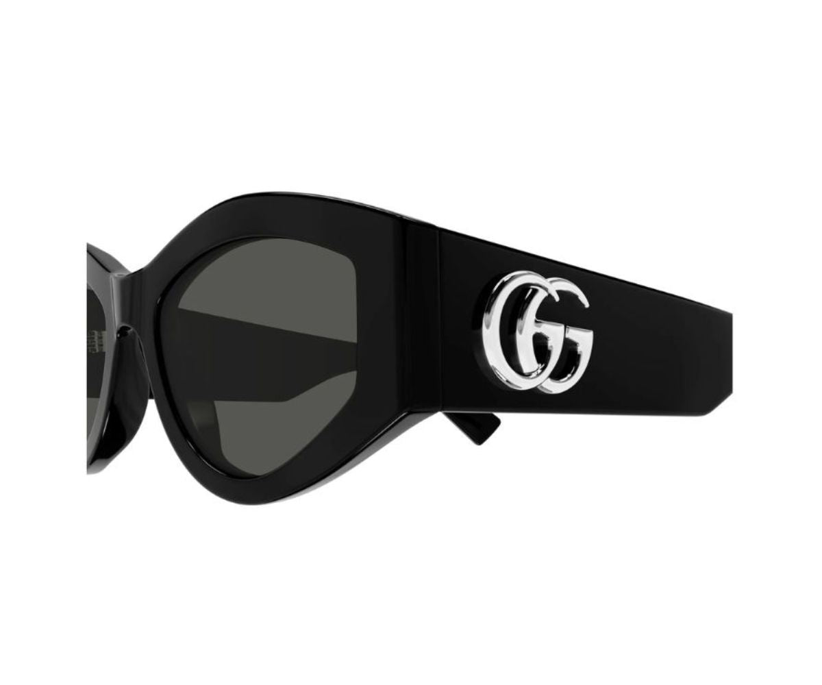 Black Gucci sunglasses with iconic double G logo on temple, luxury designer frames